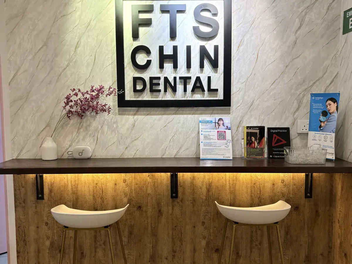 The FTS Chin Dental sign above the front counter at the clinic in Likas, minutes from Damai, Kota Kinabalu